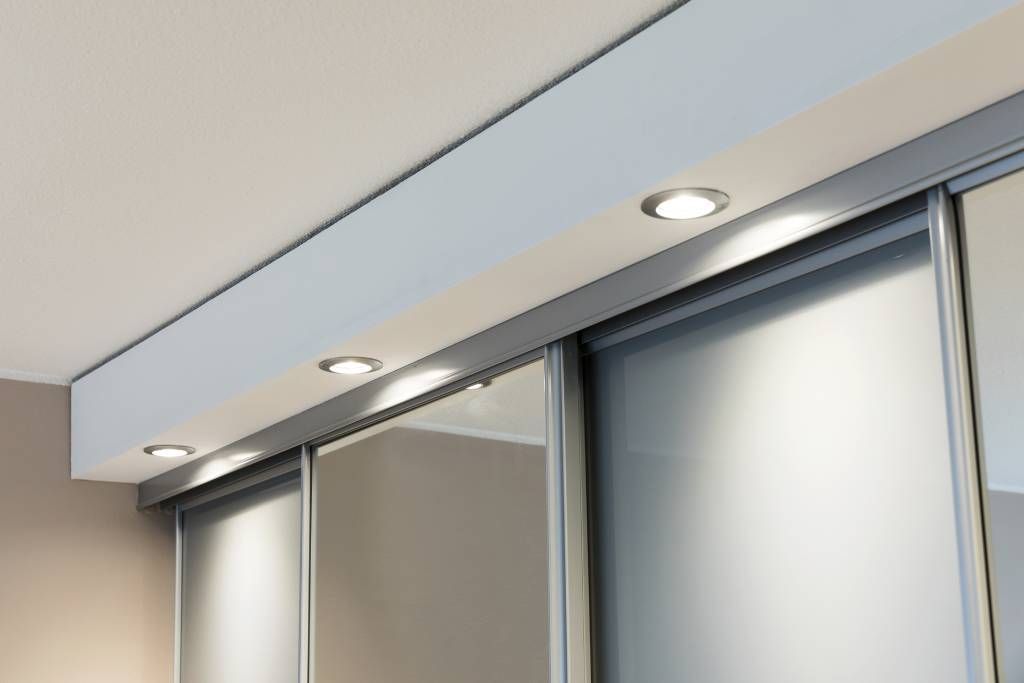 Led spotlights on the front hallway cupboard drawer, illuminating the cupboard and the mirror. Ledstore.fi